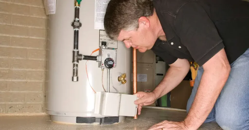 inspecting a water heater for leaks